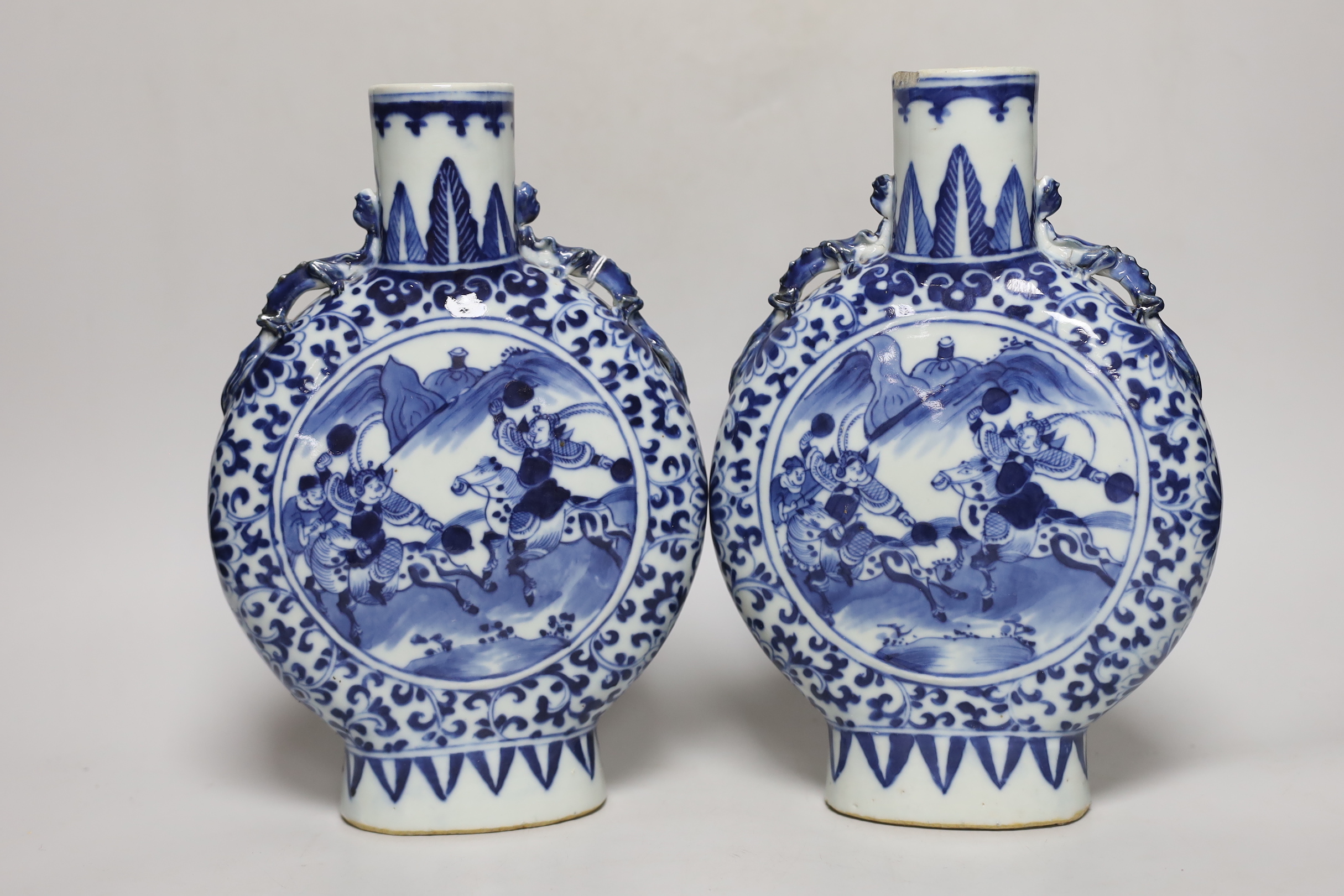 A pair of 19th century Chinese blue and white moonflasks, 26cm high